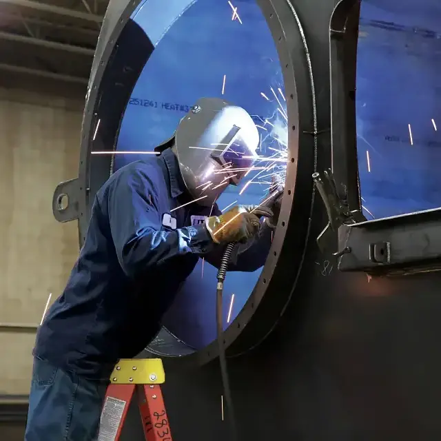 Man welding metal structure
