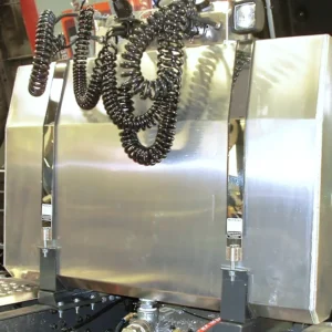 Rear of cab mounted hydraulic oil tank